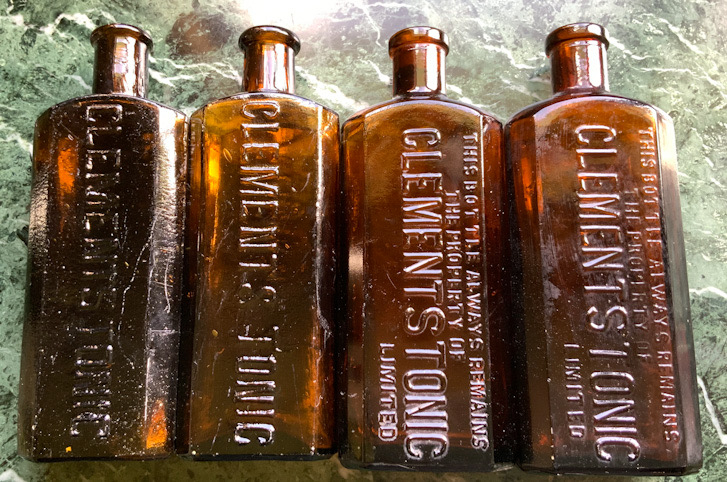 Four vintage Brown Glass Clements Tonic pharmaceutical bottles